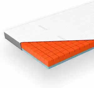 Coupe du surmatelas Genius Eazzzy montrant la mousse orange et bleue sous la housse blanche