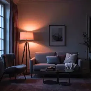 Salon ou chambre en lumière chaude le soir, ambiance apaisante propice au sommeil.
